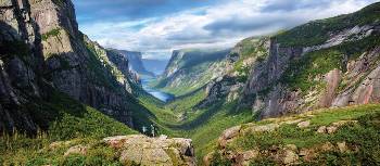 Taking in the view atop Western Brook Pond Fjord | Barrett & Mackay Photo